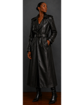Front view of woman wearing a black leather trench coat against a gray background