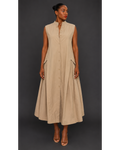 Front view of a woman wearing a beige sleeveless pleated maxi dress against a dark background