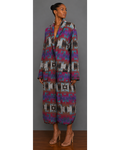 Front view of woman wearing a teal, red, brown, brown, gray, purple, and black patterned blanket wrap coat with collar and front patch pockets