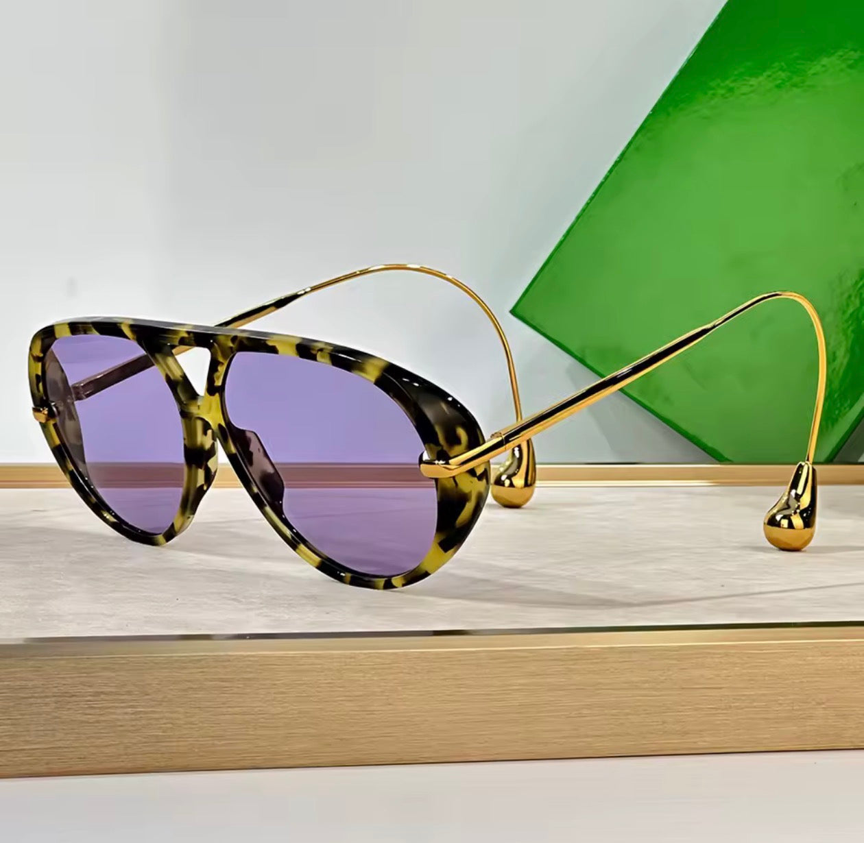 Purple tortoise shell sunglasses