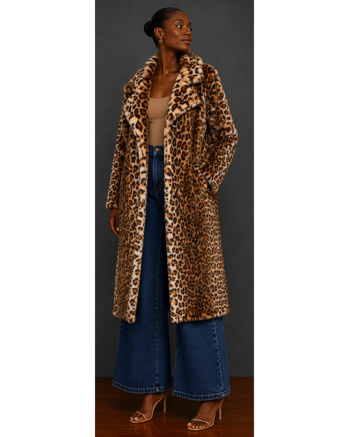 Woman wearing a leopard print coat and blue jeans against a neutral background